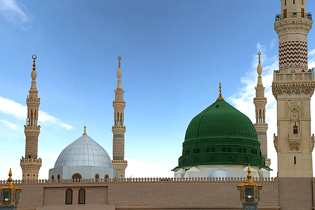 The iconic Green Dome of Al Masjid-e-Nabawi surrounded by elegant minarets in Madinah