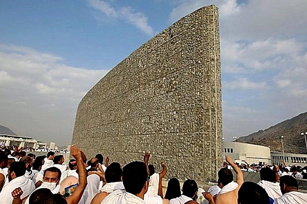 Pilgrims performing the symbolic stoning ritual at Jamarat during Hajj in Mina near Makkah, Saudi Arabia.