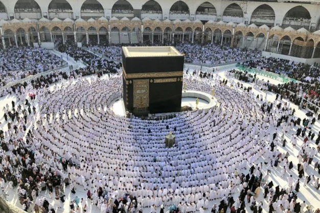 Holy Kaaba in Makkah surrounded by Umrah pilgrims performing Tawaf at Masjid-al-Haram.