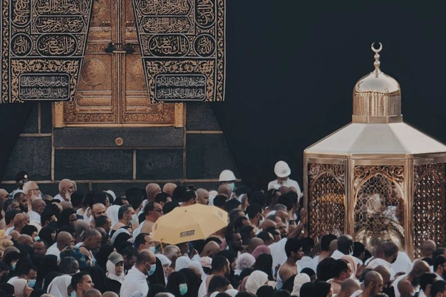 Close-up view of the Kaaba, Maqam Ibrahim and pilgrims at Masjid al Haram in Makkah.