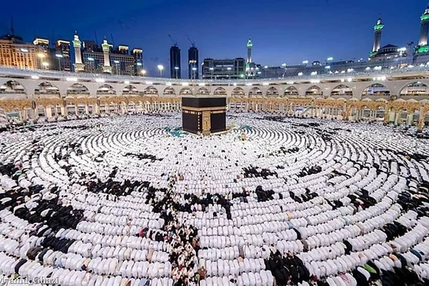 Thousands of pilgrims offering Salah in rows around the Kaaba at Masjid-al-Haram in Makkah.
