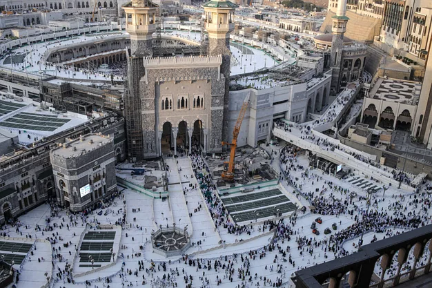 Aerial view of Masjid-al-Haram in Makkah with pilgrims entering the Grand Mosque for Umrah and Hajj.