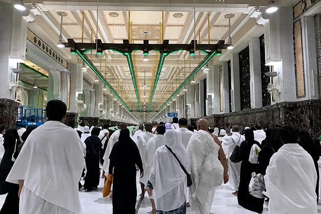 Pilgrims walking through the Sa'i corridor between Safa and Marwah at Masjid al Haram during Umrah pilgrimage in Makkah.