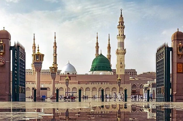Low-angle full view of Masjid-e-Nabawi from the main entrance in Madinah, Saudi Arabia.
